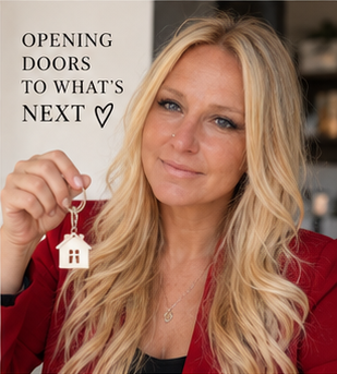 Chelsea Long in a red blazer holding a house key